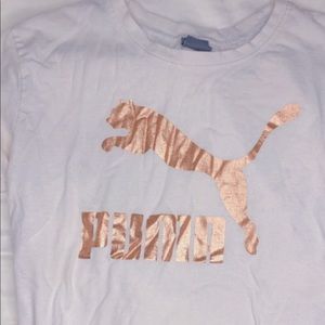 A rose gold puma shirt
